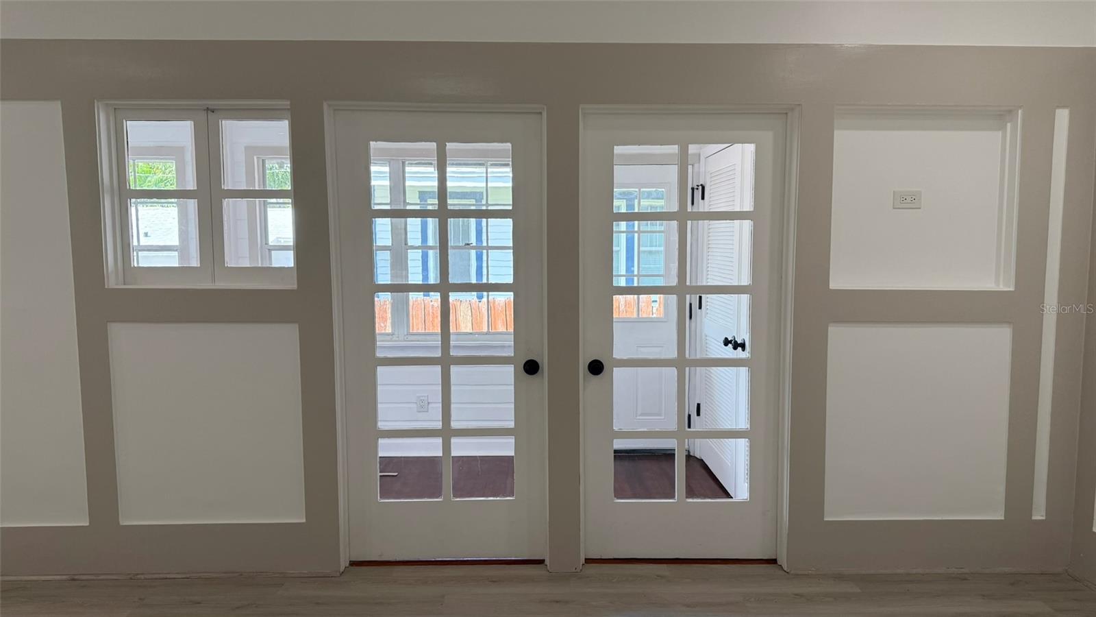 Beautiful great room... doors to rear sunroom.