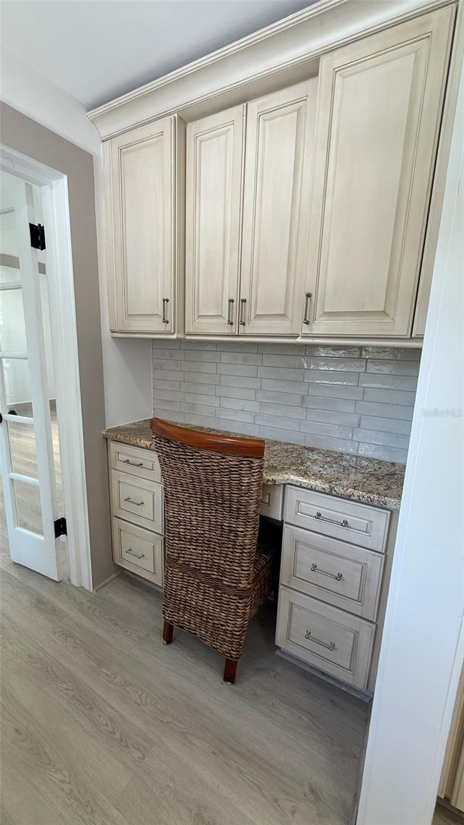 Family Office Desk next to kitchen and master suite
