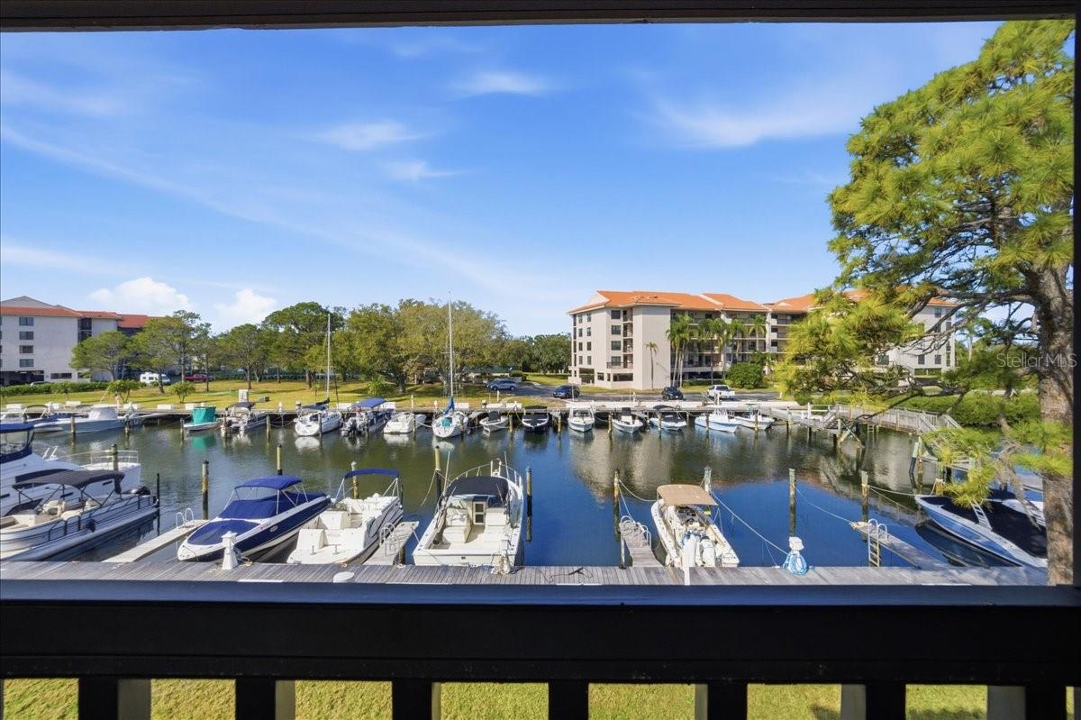 The spacious bumped-out balcony upgrades include tile floors, a decorative ceiling fan and roll down shades for comfort, and elevated second floor views of the marina and Saint Joseph Sound/Gulf of Mexico.  A truly ideal space to relax and enjoy enviable sunsets in the evenings and watch the boats come in and out and the birds and marine wildlife pass by during the day.