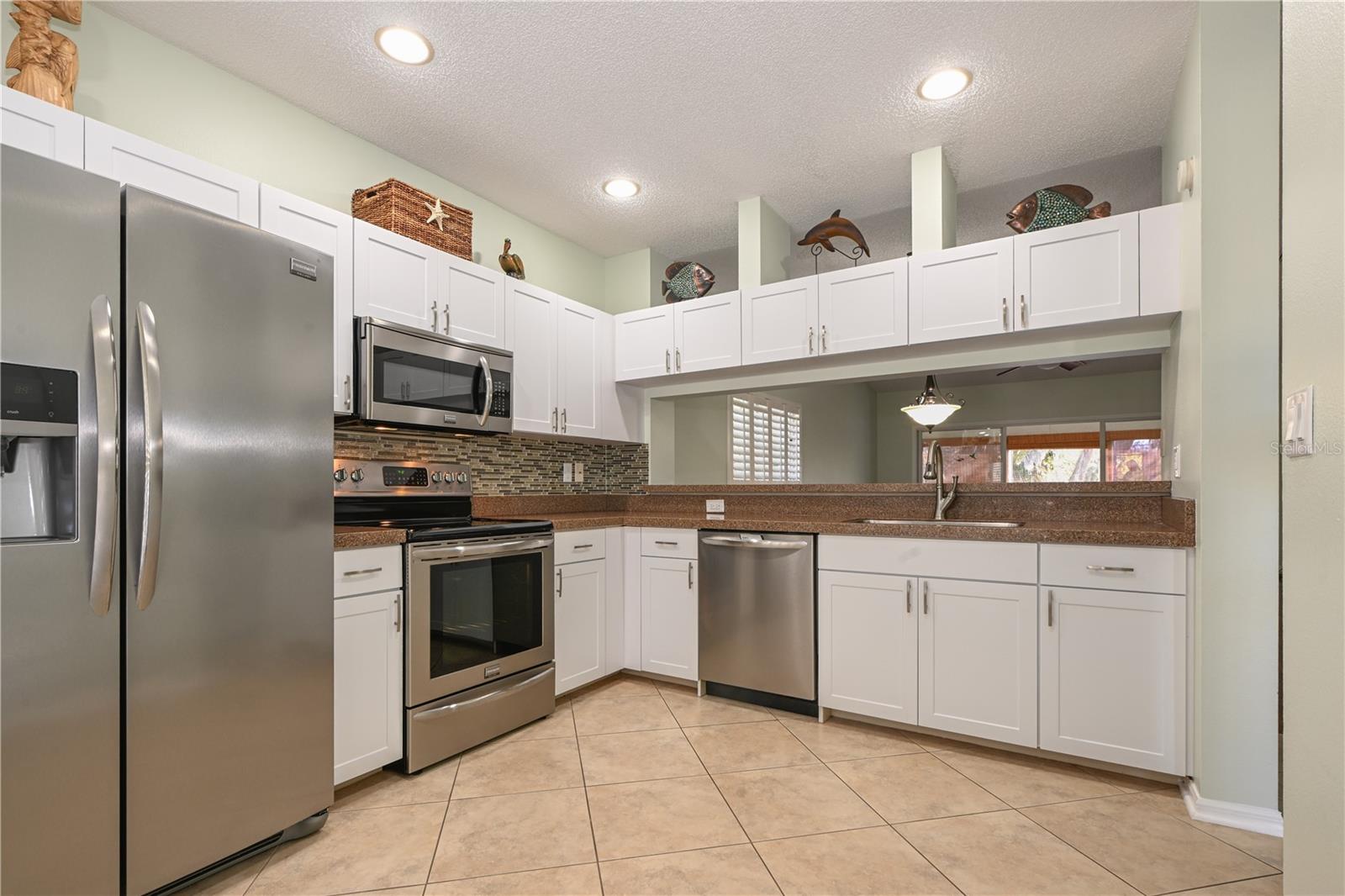 The kitchen features stainless steel Frigidaire Gallery appliances