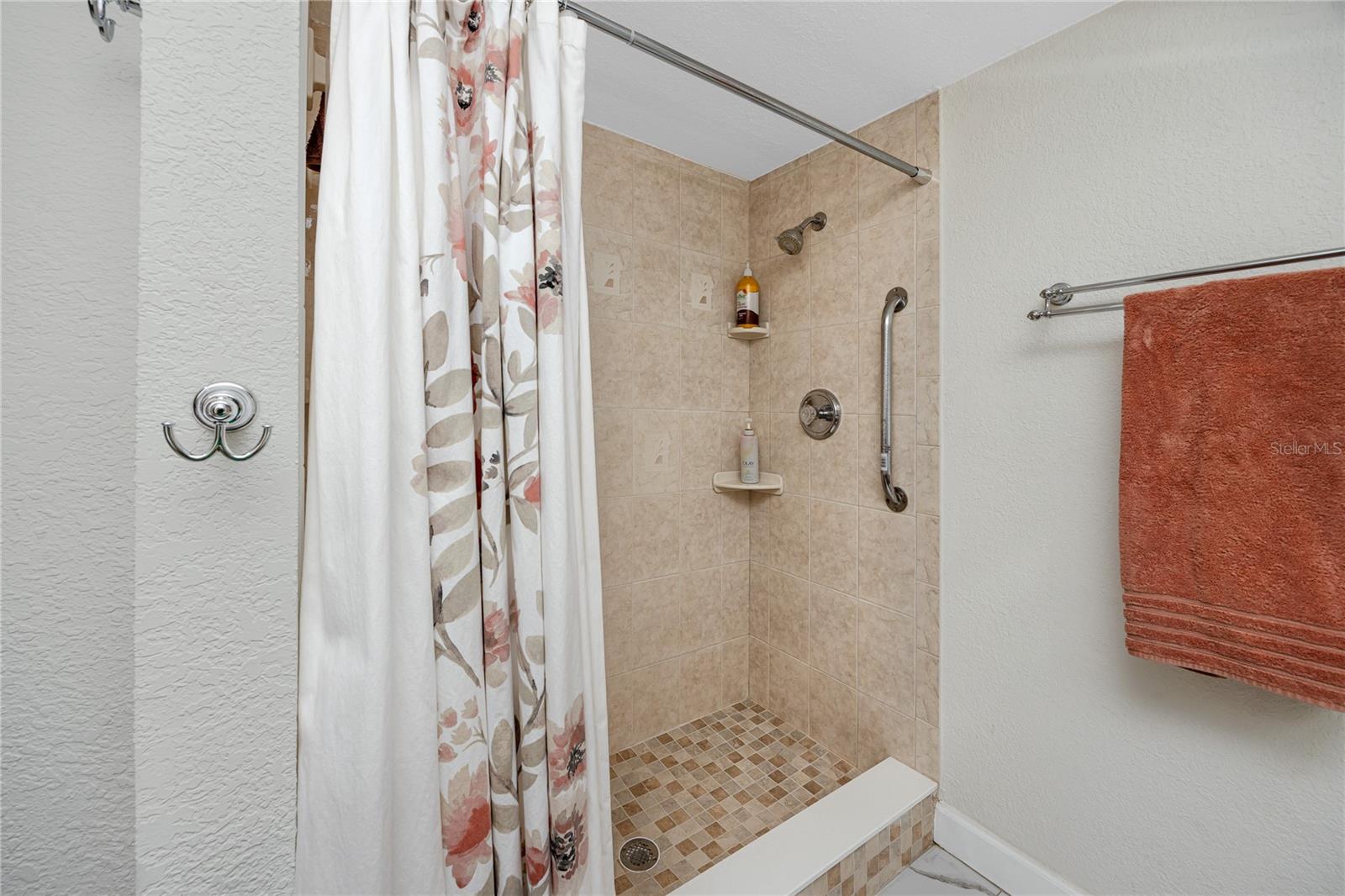 Shower with grab bar