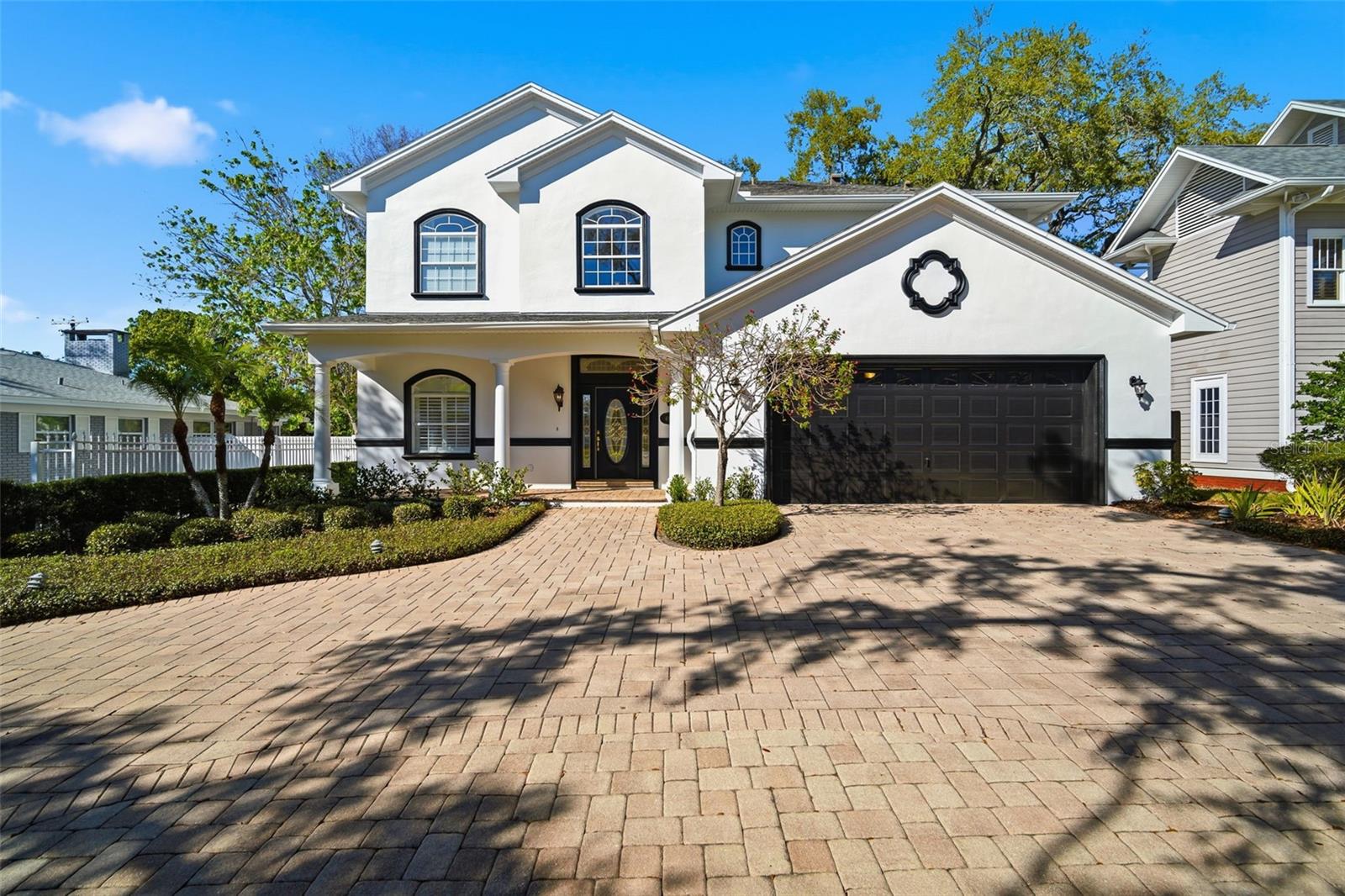 Front Elevation with two car garage and circular diveway