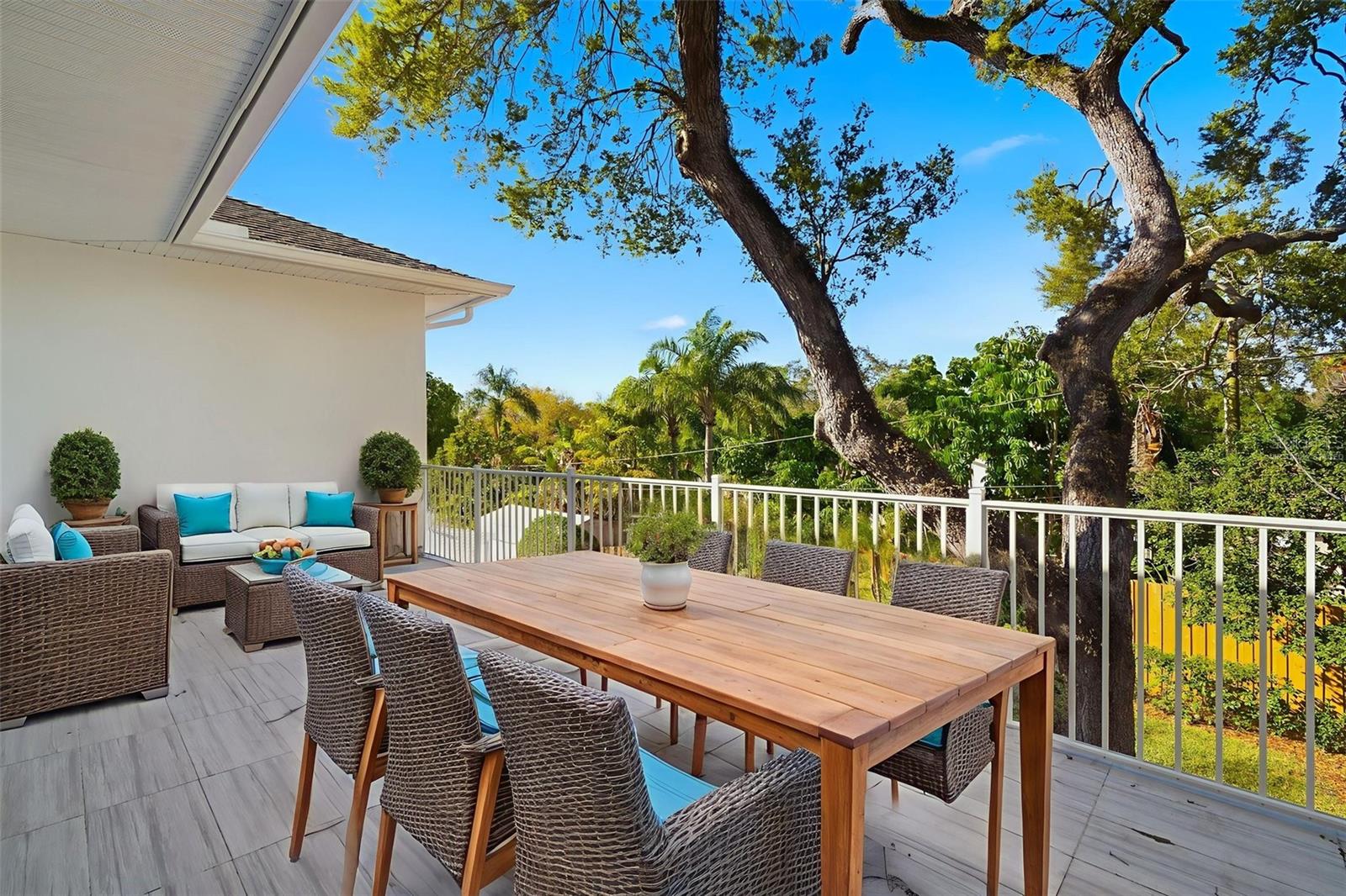 Virtually Staged, open balcony off of the primary bedroom