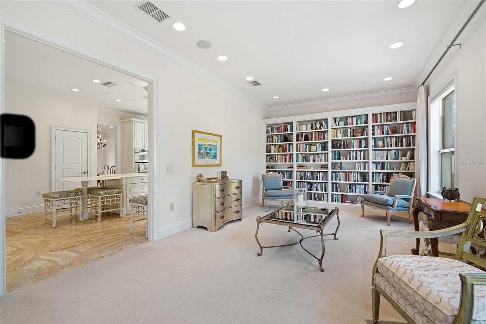 Livingroom looking to kitchen built-in bookcases