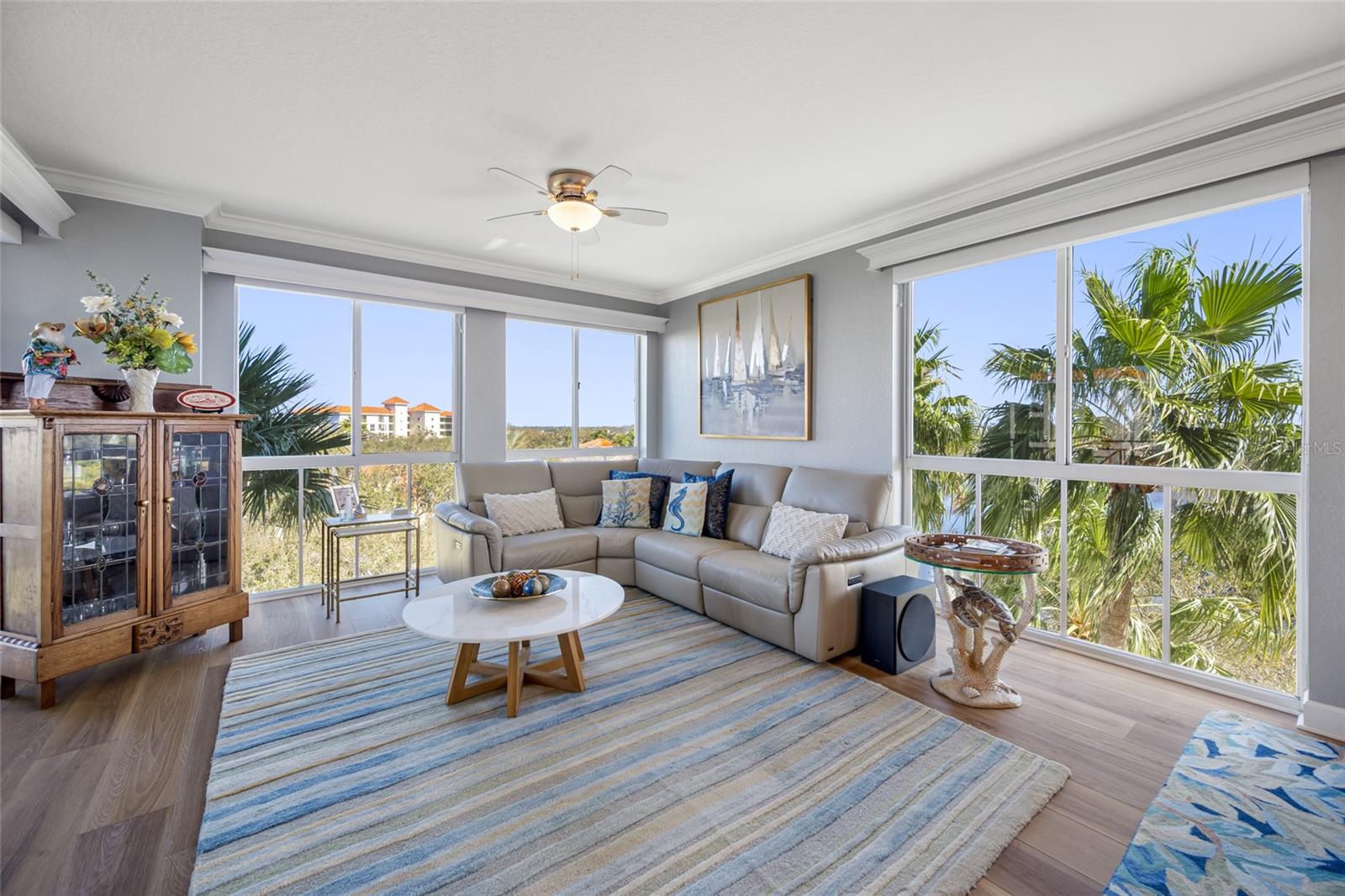 Family room surrounded by Floor to Ceiling Windows, lots of Natural light