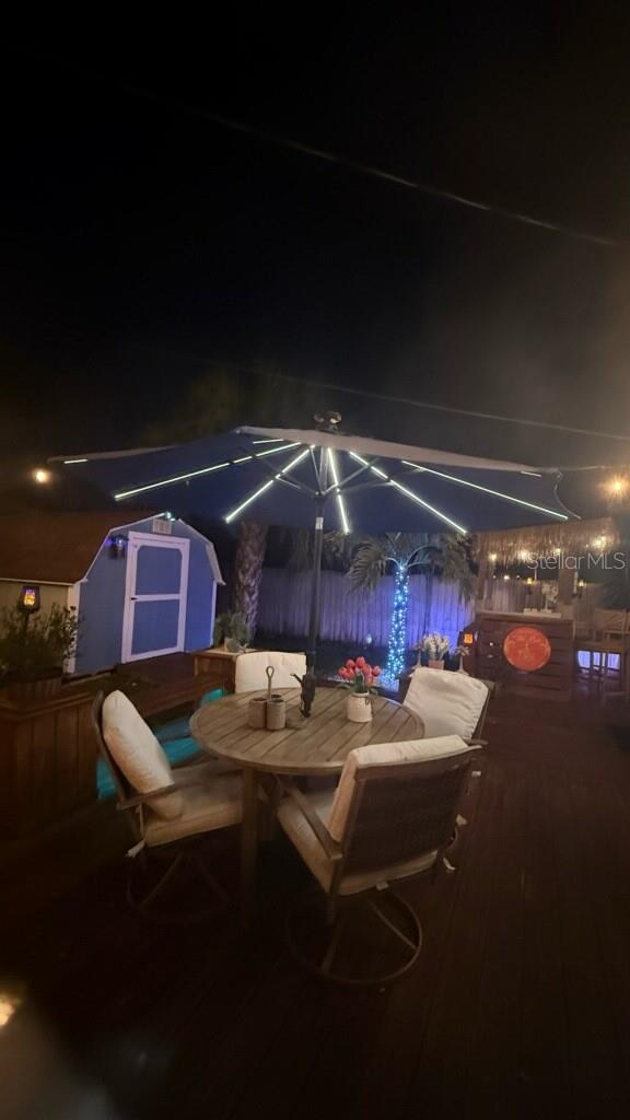 Lighted umbrella on patio deck.