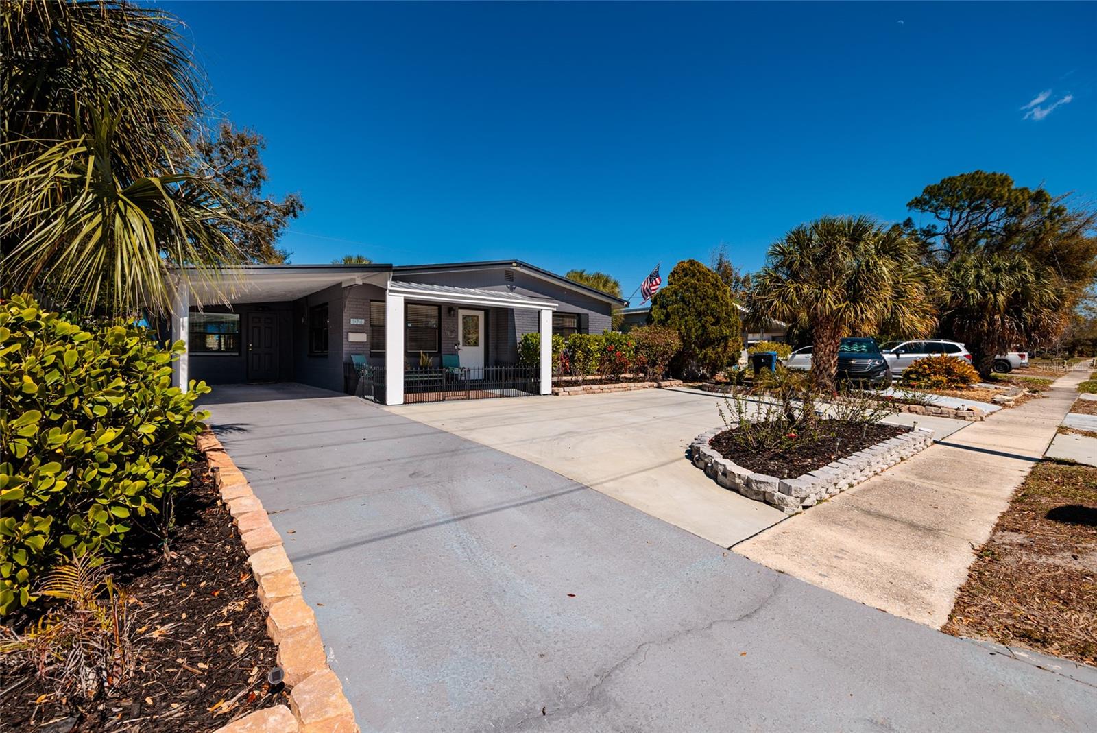 Carport & circular driveway.