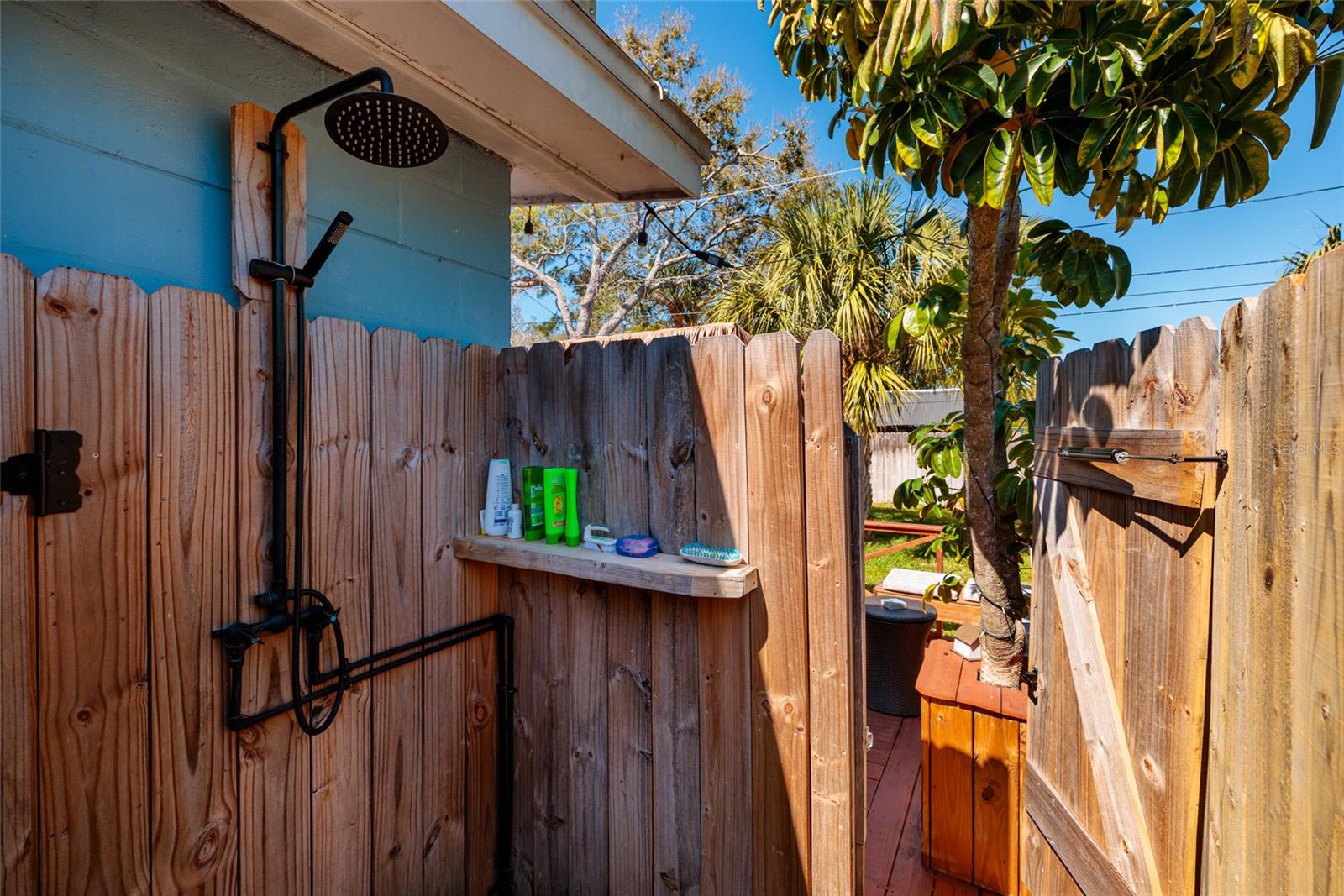 Outdoor shower on side of house off the back deck.