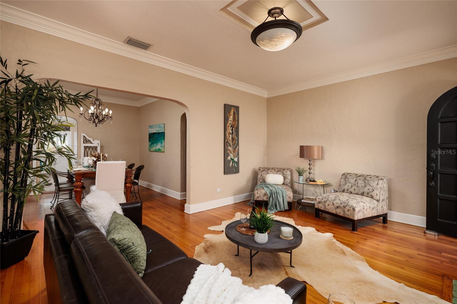 Hardwood floors, crown molding, plantation shutters throughout.