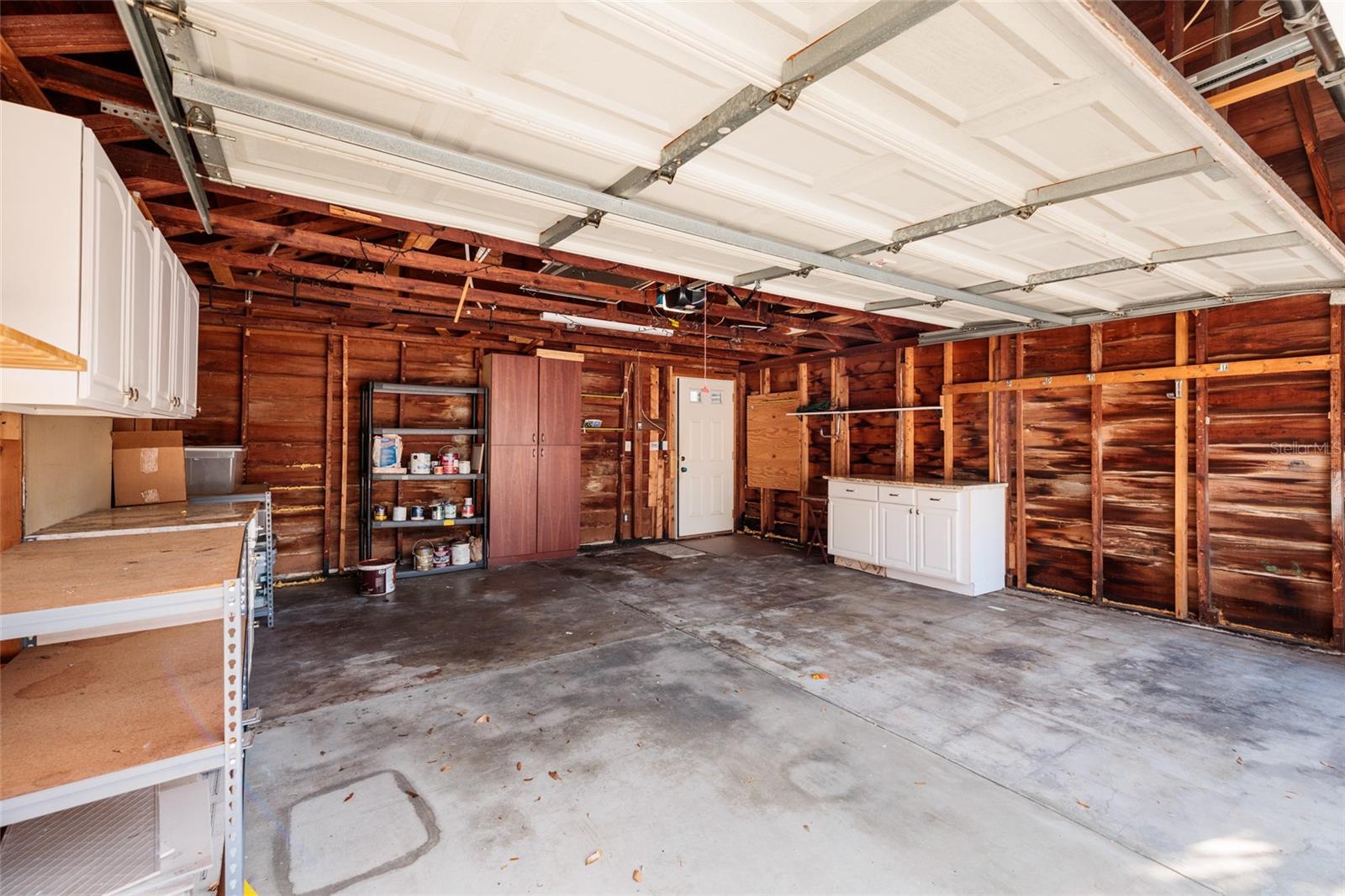 2 car garage with remote access and built in storage.