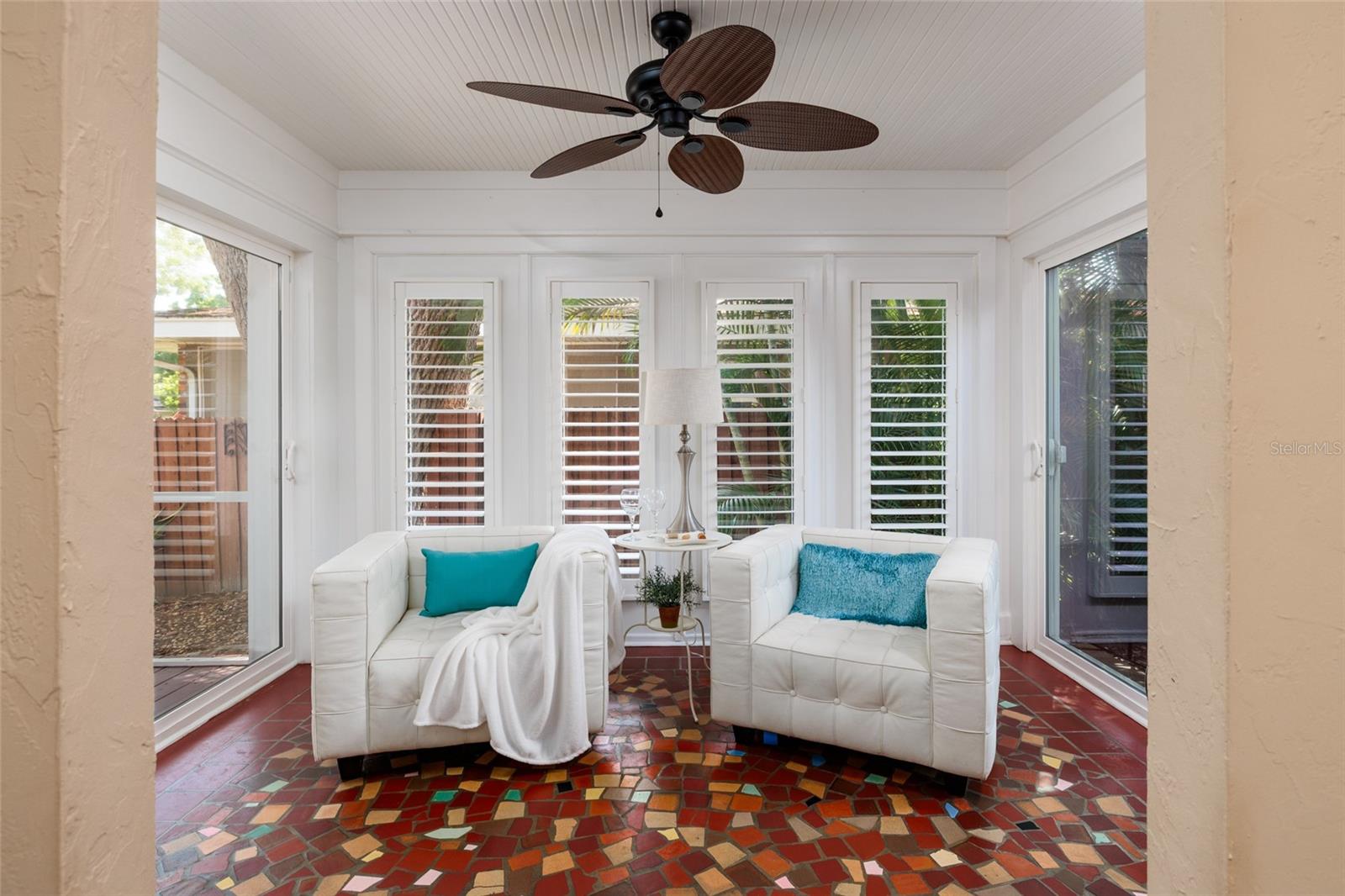 Coffee in your Sunroom with Spanish fractured tile floors. Step out to outdoor Patio or screened porch.