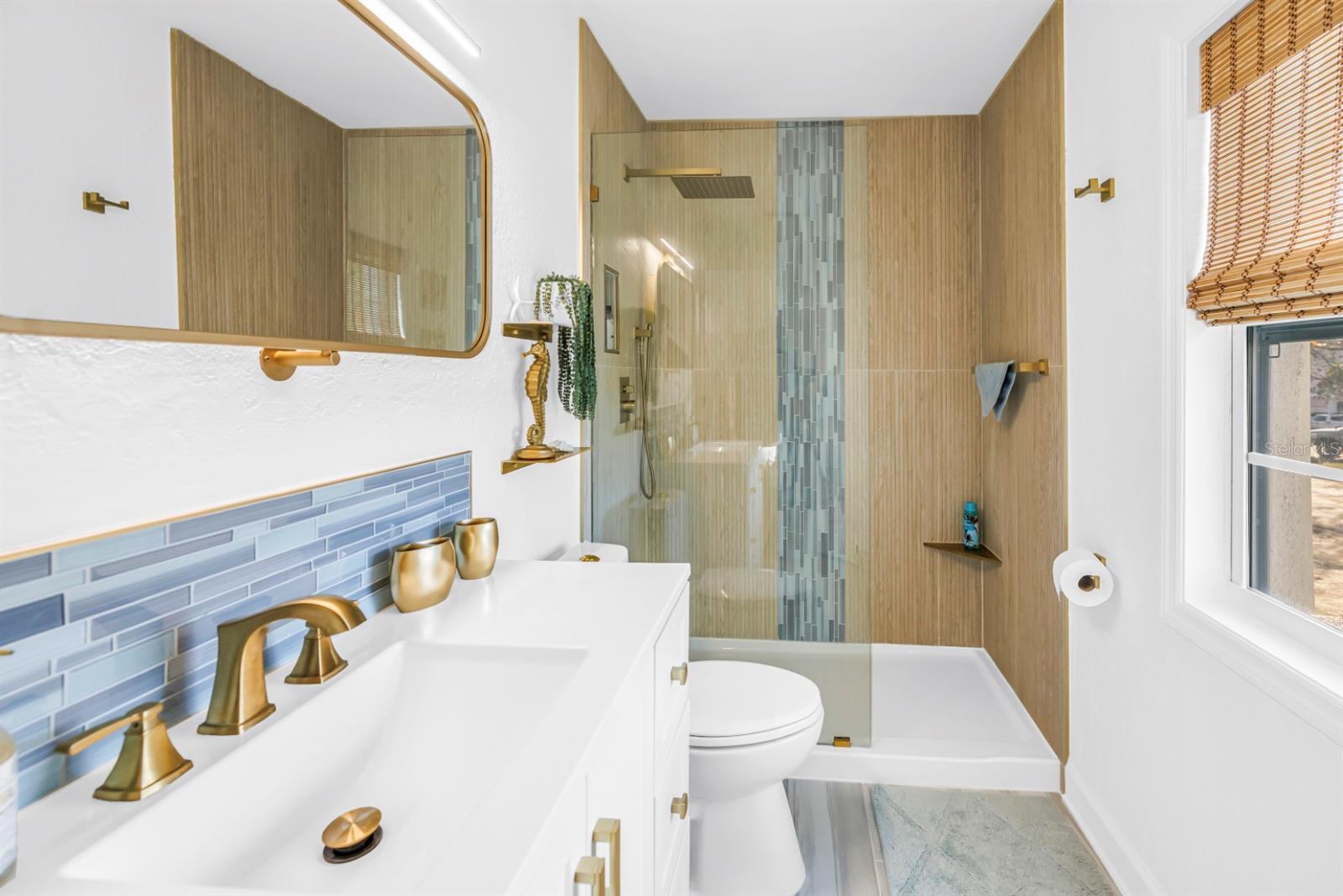 Stylishly renovated bath offering a fresh, spa-inspired feel.