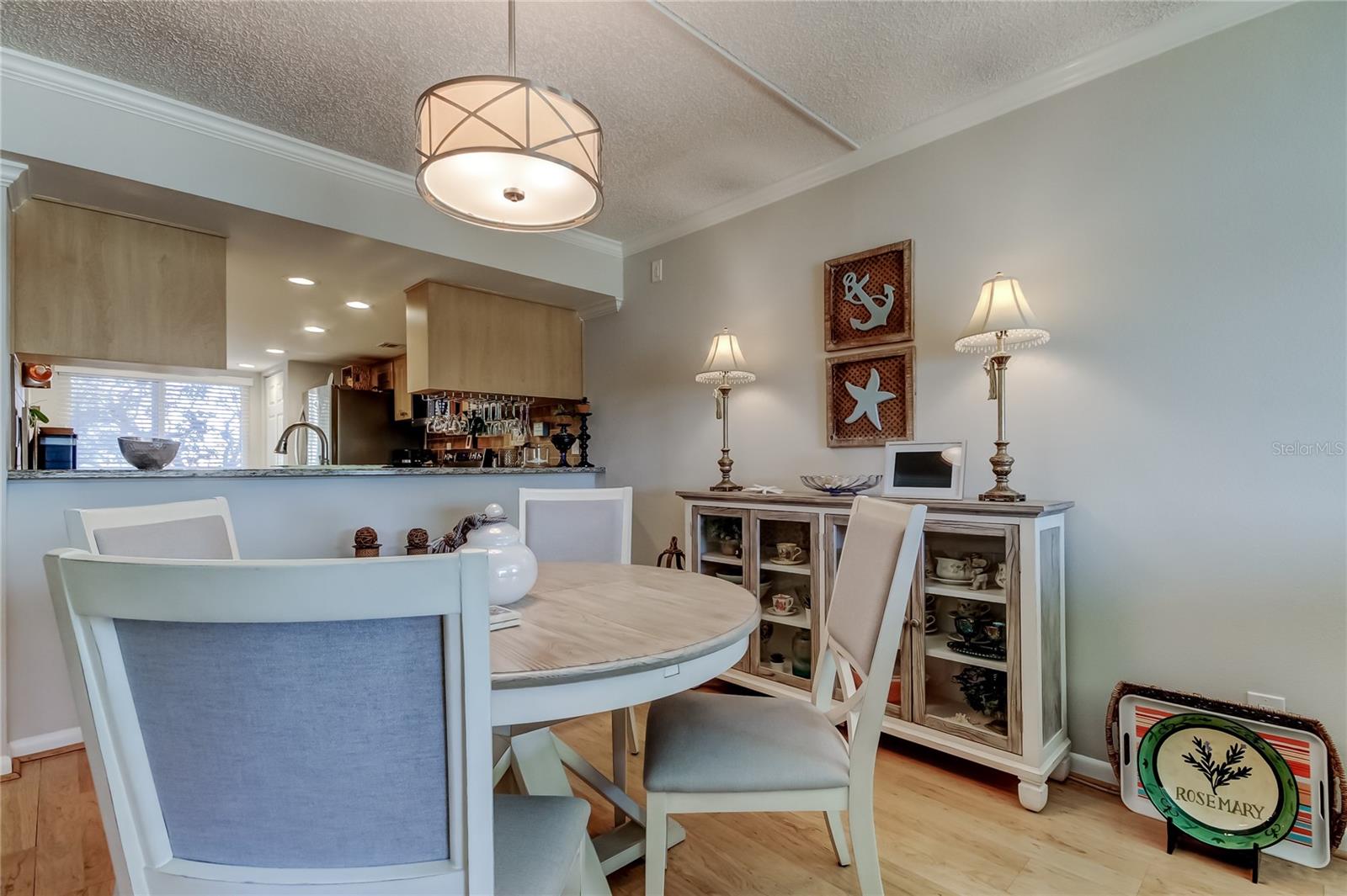 The Kitchen pass-through is next to the Dining Area.