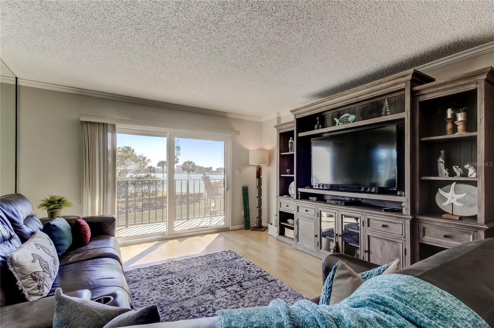 Living Room with sliders to balcony and the awesome view of the water.