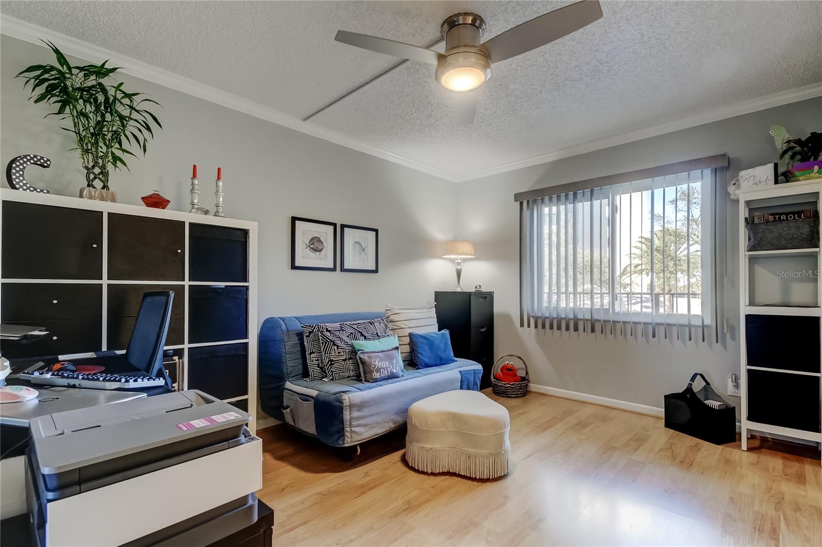 Bedroom 2 has ceiling fan, laminate flooring, window with blinds.