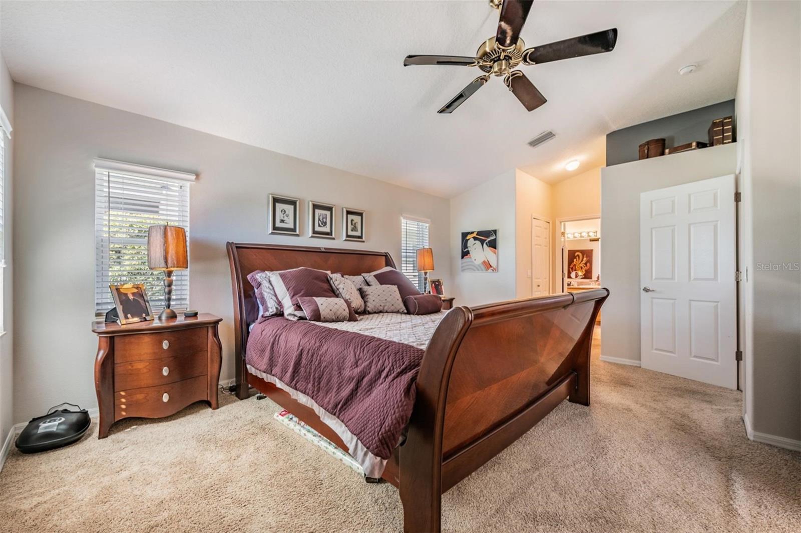 Primary bedroom with vaulted ceilings