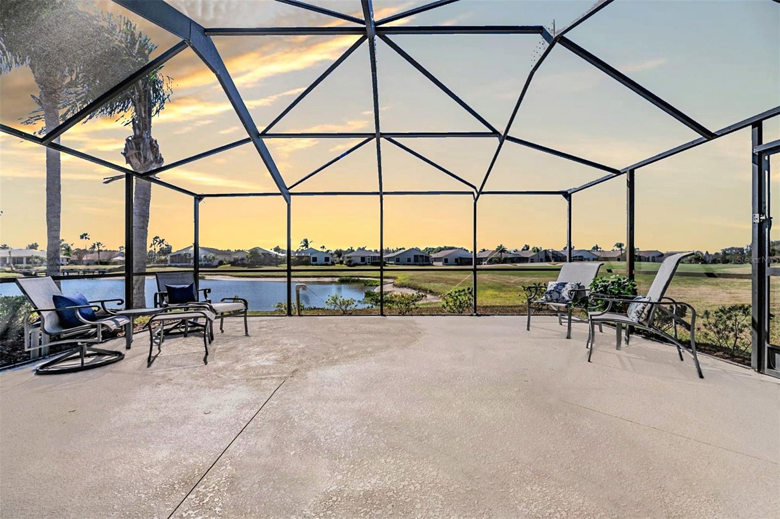 Screened in lanai with pond and golf views