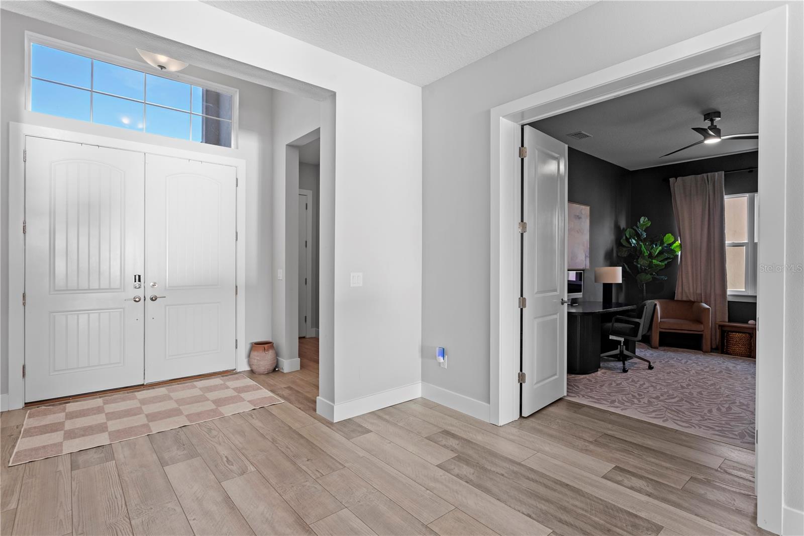 Grand entry with immediate views of the pool, spa, and pond.