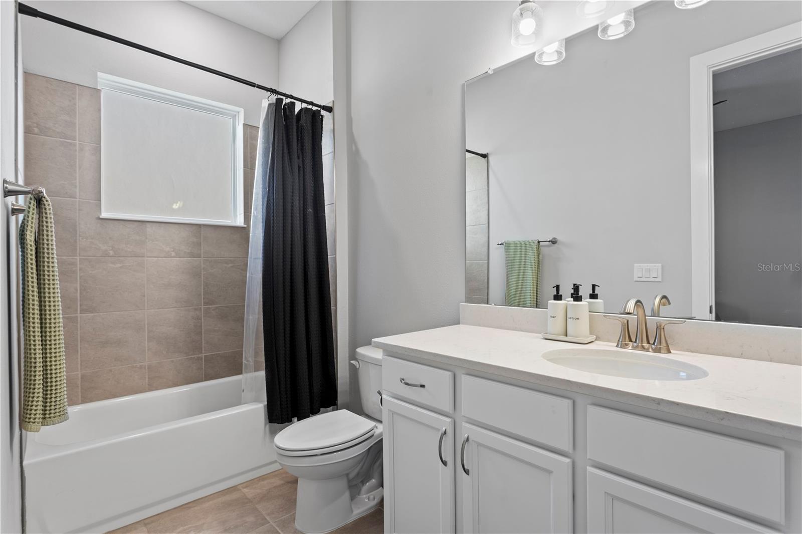 Full bathroom serving secondary bedrooms.