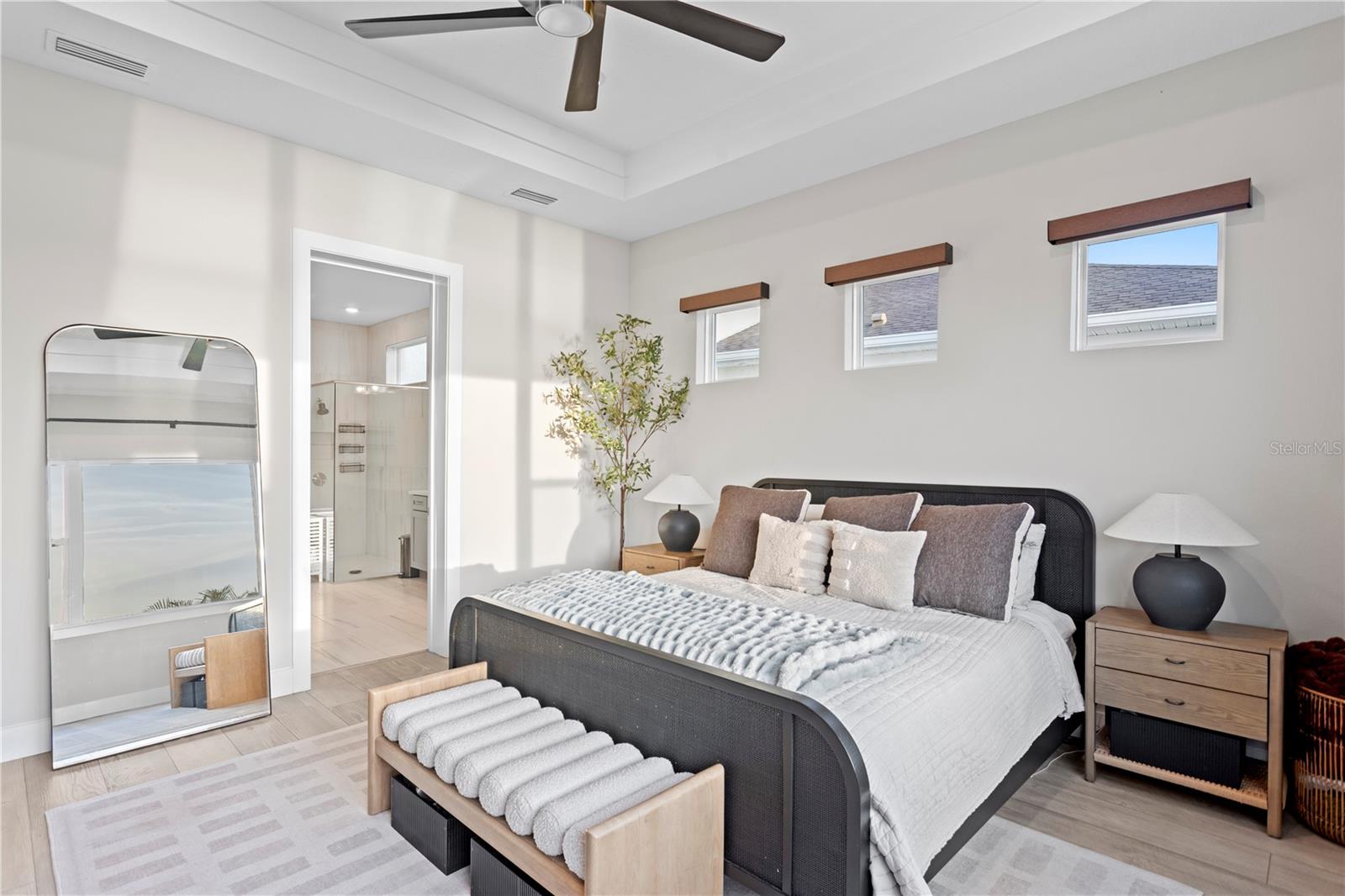 First-floor primary suite featuring tray ceilings.