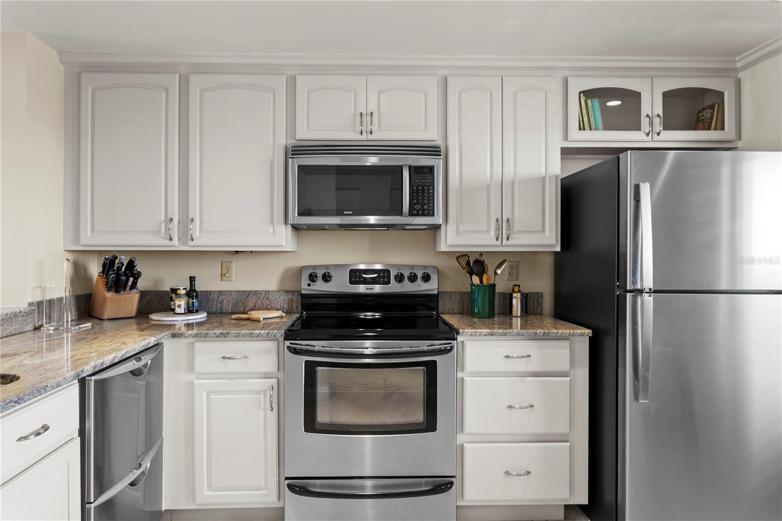 The open-concept kitchen features stainless steel appliances