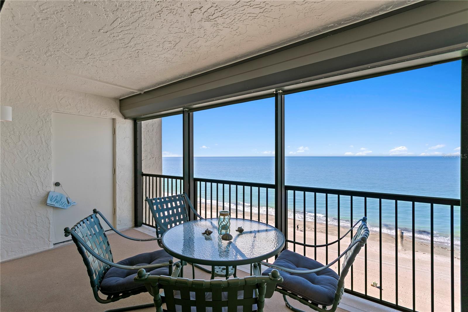 A convenient storage closet on the balcony keeps all your beach essentials neatly tucked away, and hurricane shutters provide added peace of mind.