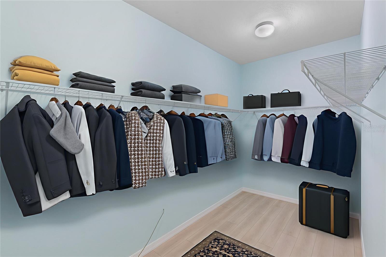 Virtually staged spacious primary bedroom closet