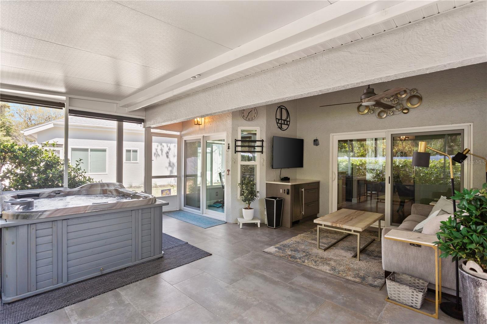 Covered Lanai with Custom Automated Outdoor Shades, Dry Bar, Beverage Fridge and Hot Tub