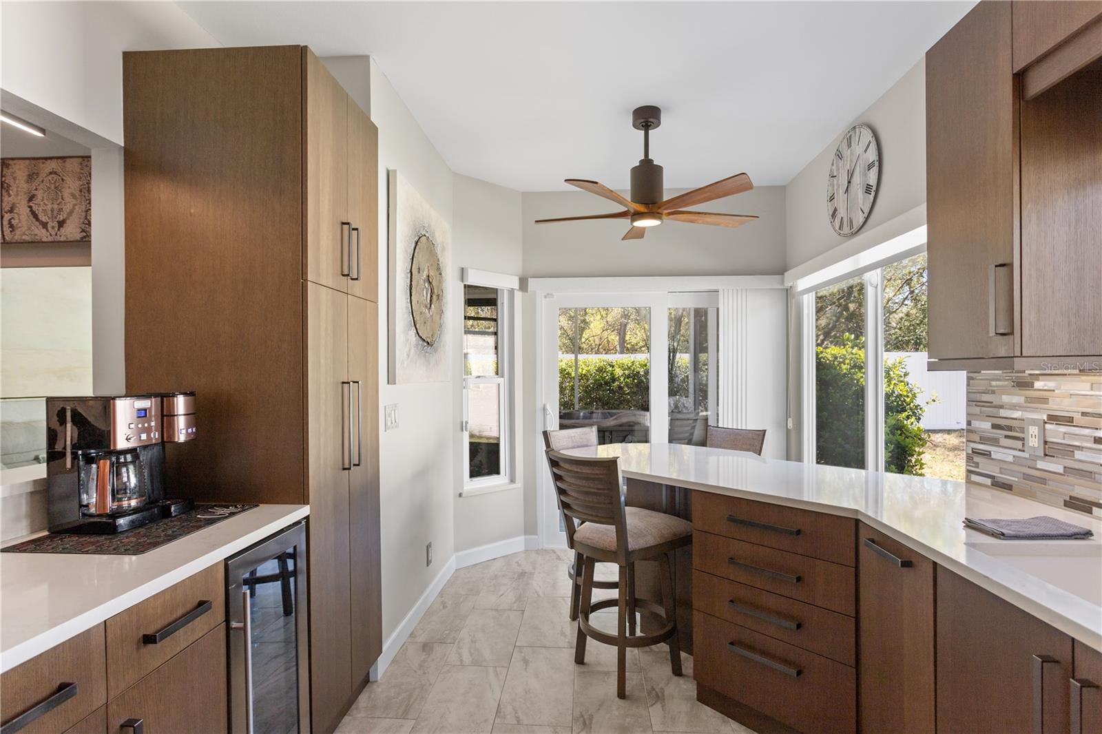 Custom Kitchen with High End Cabinetry, Stainless Steel GE Cafe' Appliances and Quartz Countertops