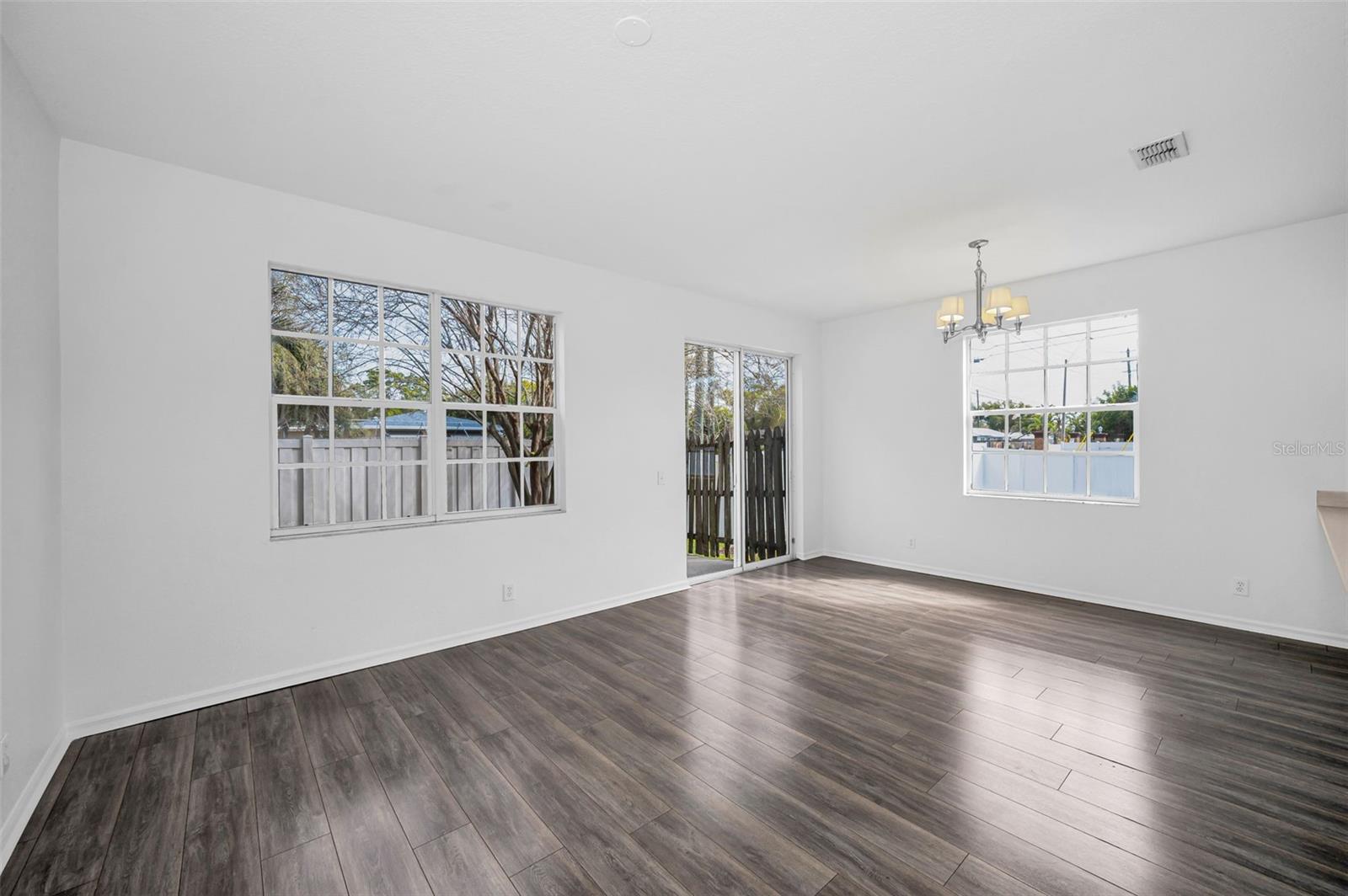 Natural light pours through the windows and sliders making the home bright and inviting.