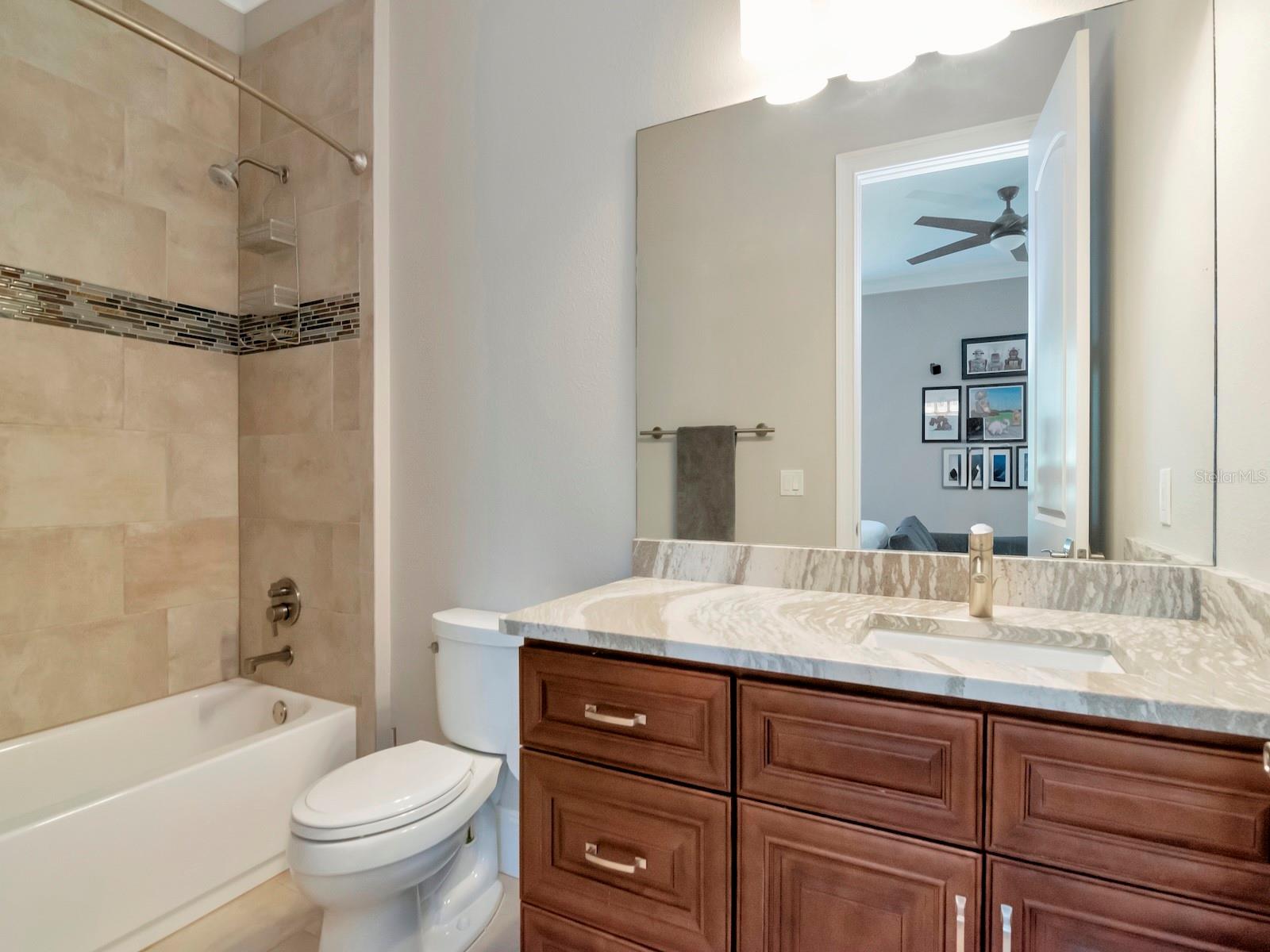 Ensuite bathroom serves as pool bath as well.