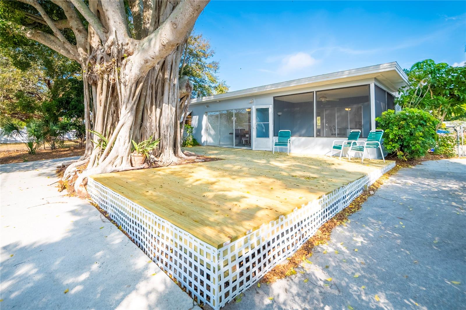 Backyard with screen room and new deck