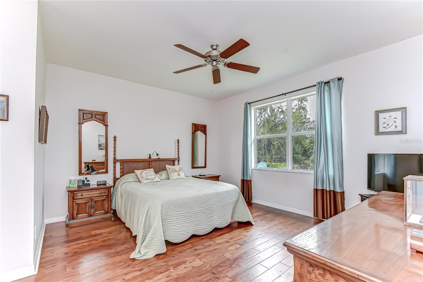 Spaciou primary bedroom with updated floors!