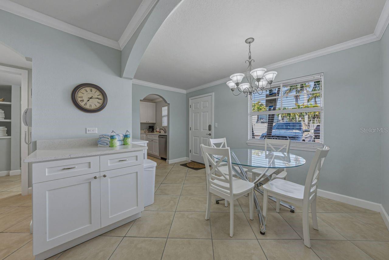 View of dining room from the living room. Furnished as seen