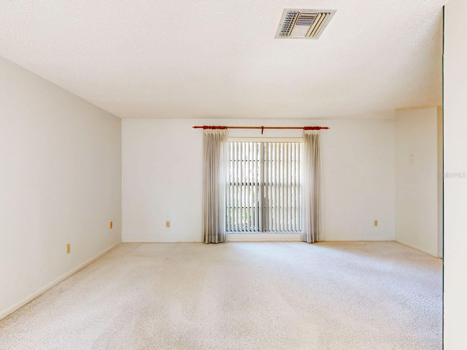 Huge living room/ dining room with natural light