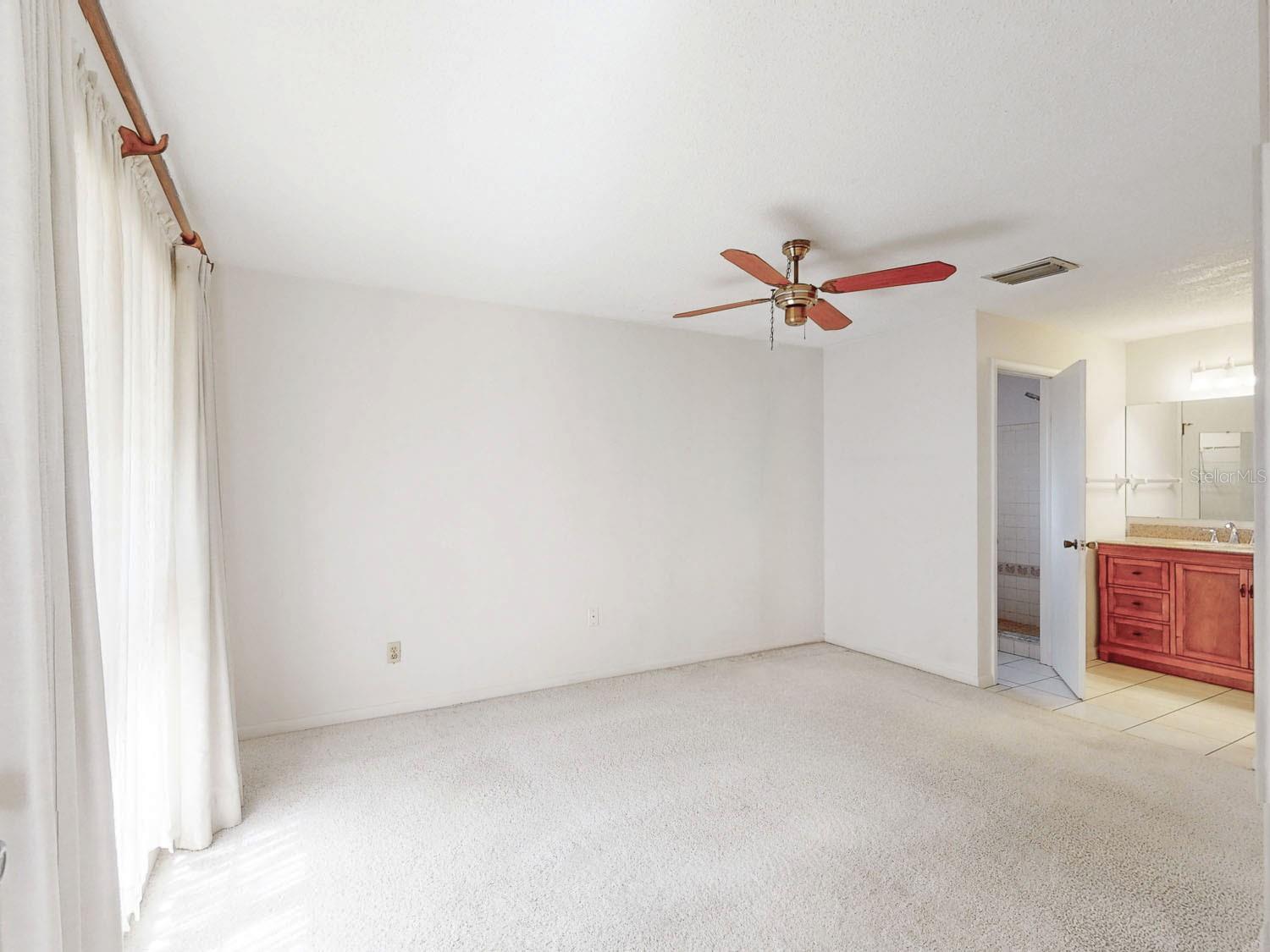 Primary bedroom and vanity area