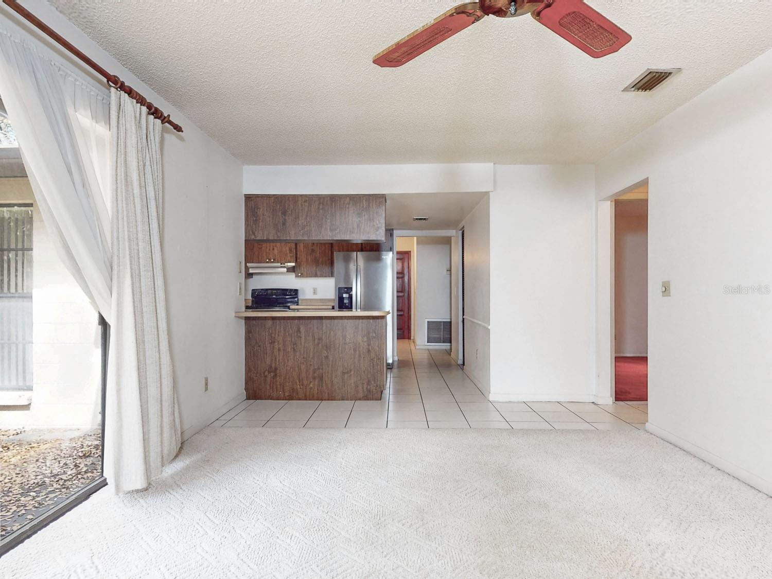 Open family room area and convenient pass-through kitchen