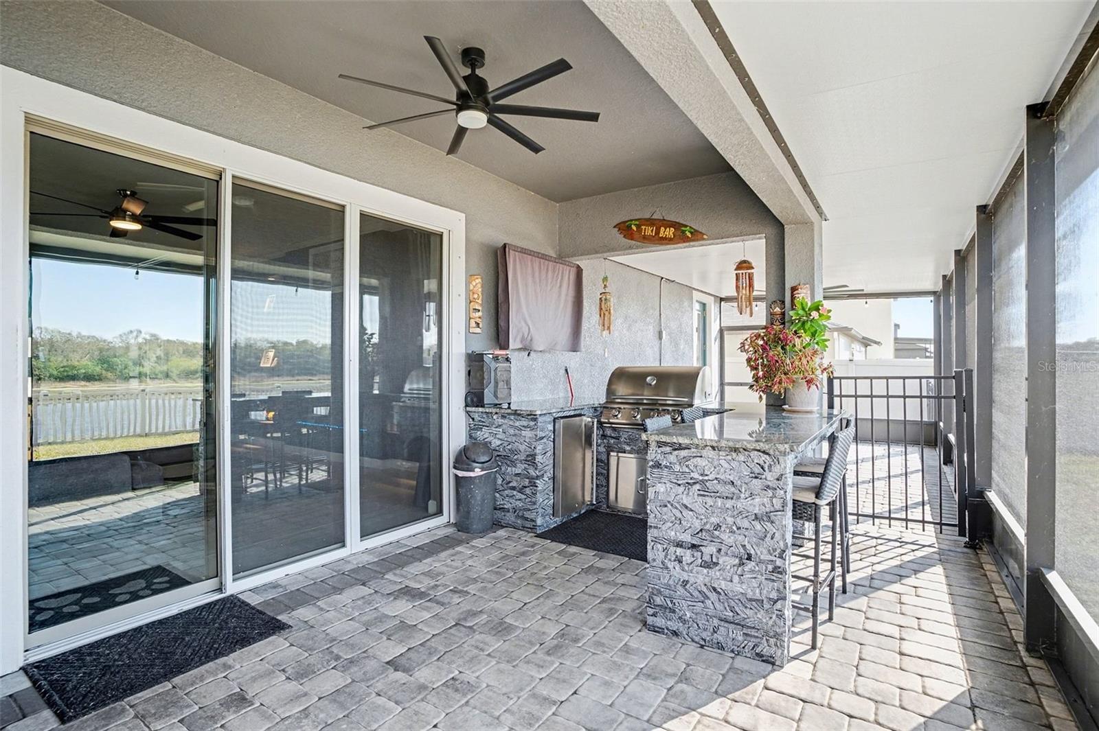 built in bbq on screened in extended patio