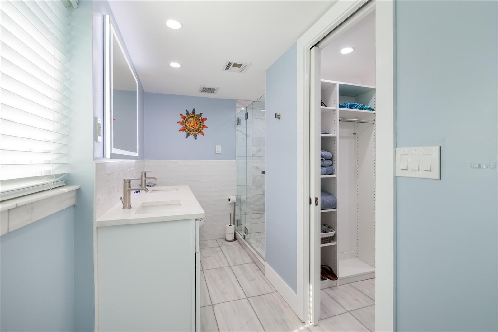 Beautiful double vanity with large step in shower