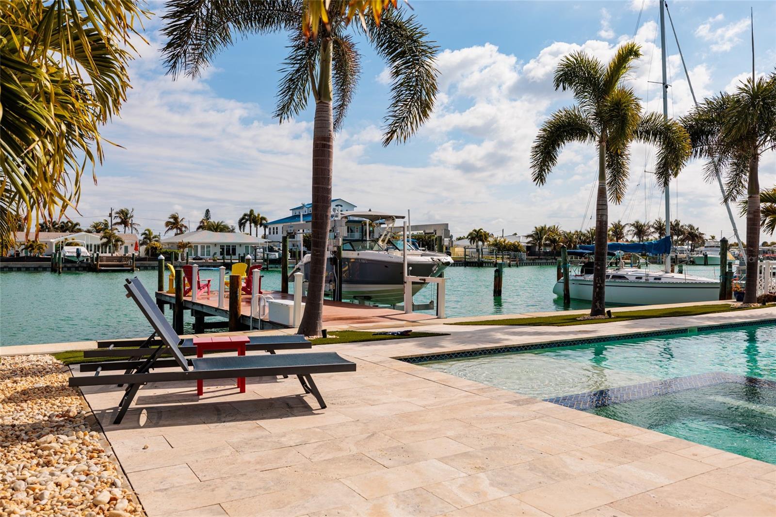 Travertine deck, sun shelf and hot tub