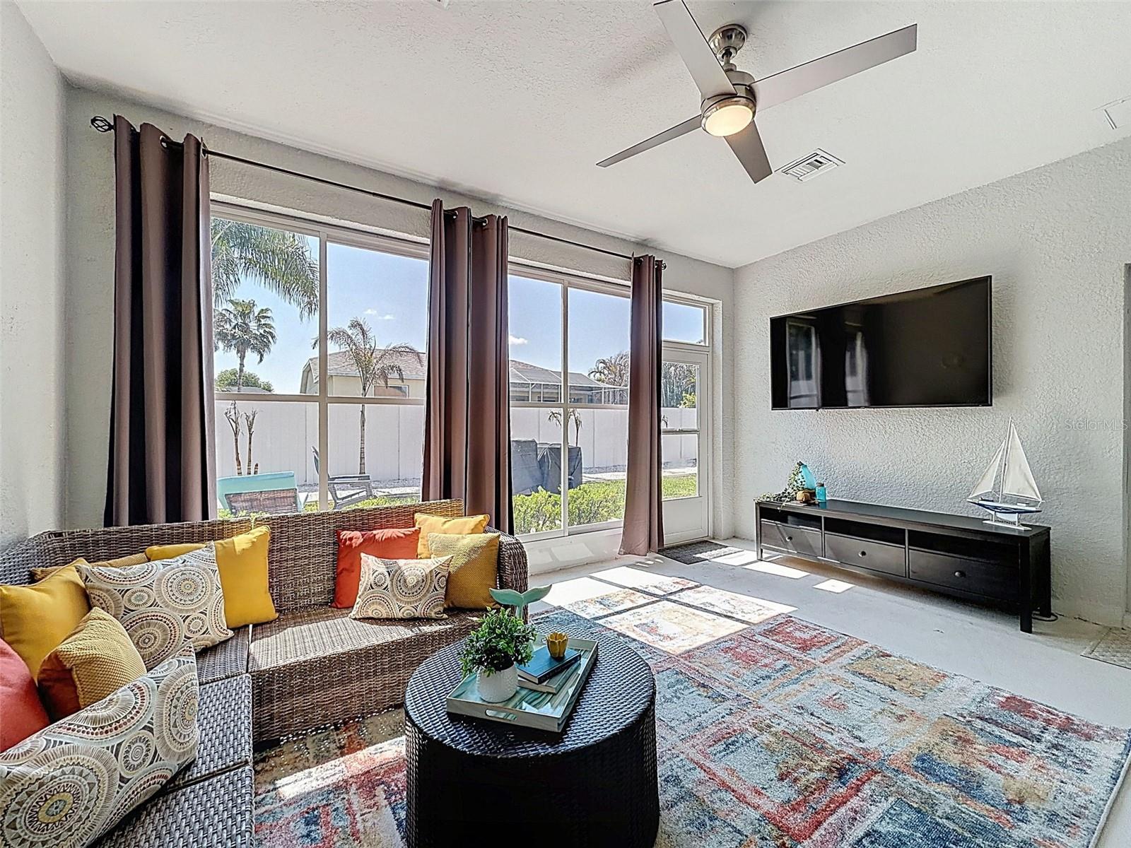 Converted back porch makes a great Florida Room!  New Fan, wired for TV provides a great retreat!