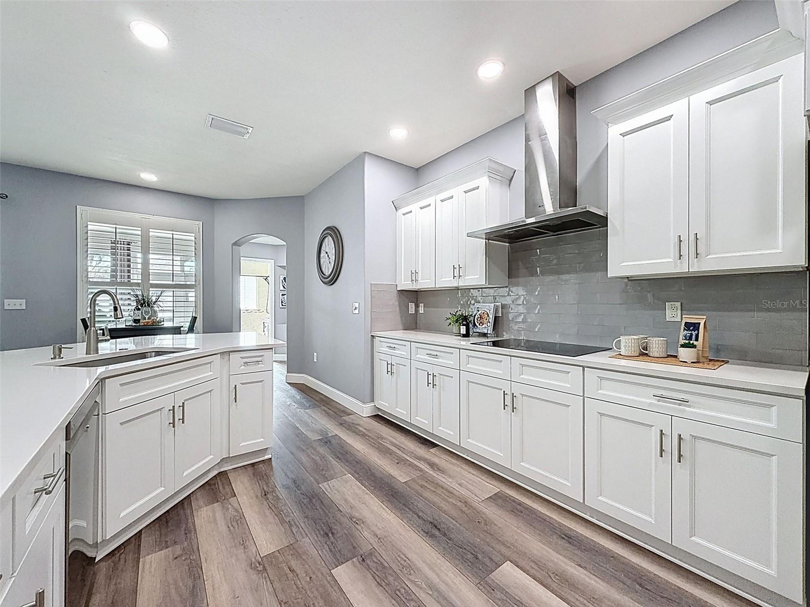 view into the back bedrooms and kitchen nook.