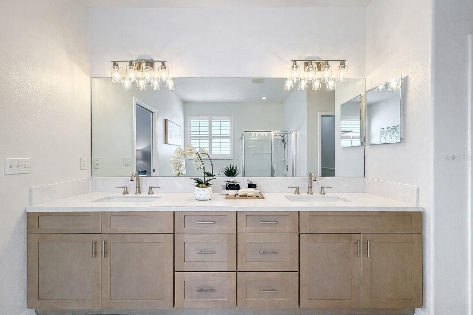 Beautiful master double sink vanity with new stone counter top.