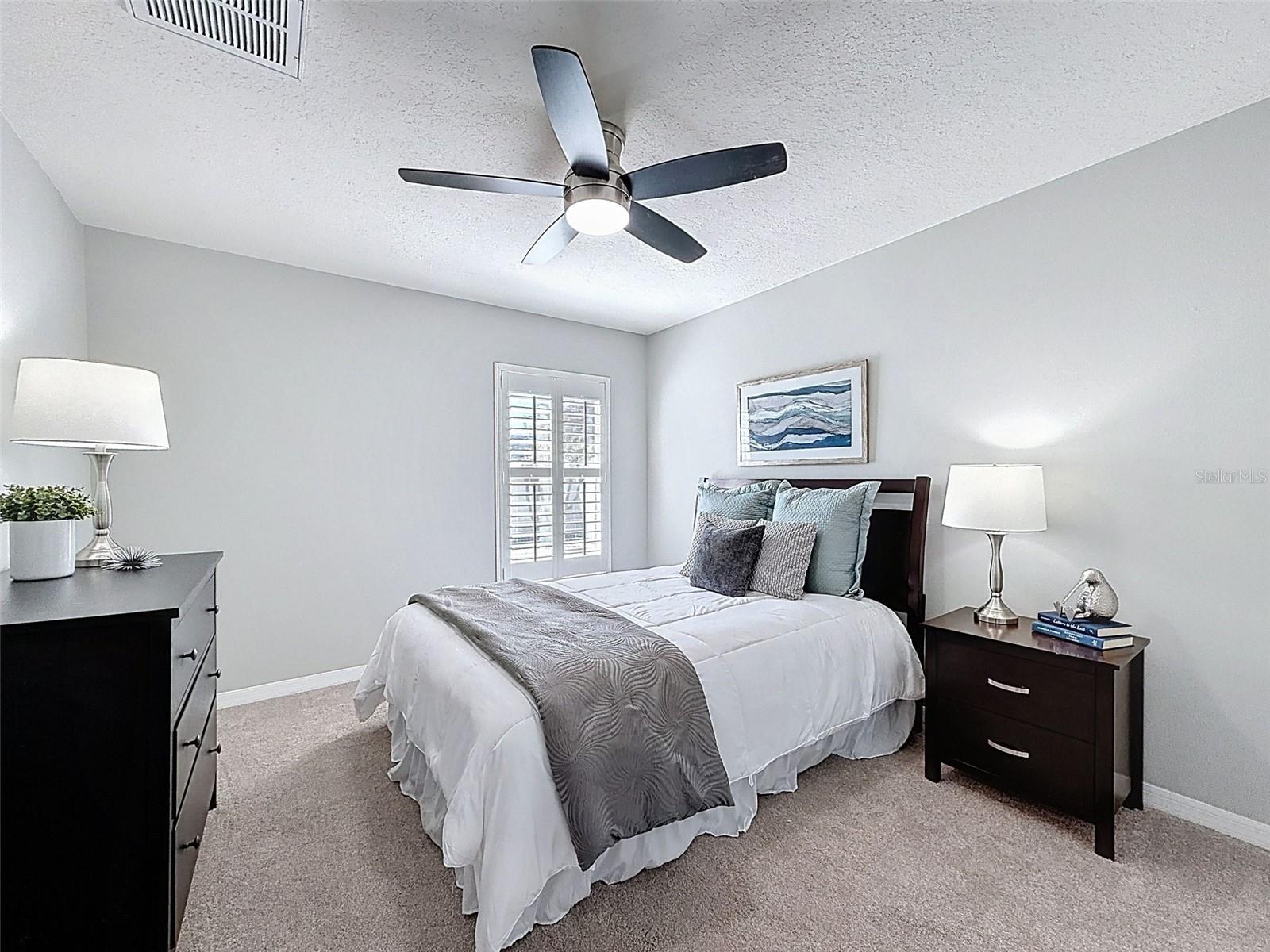 Third bedroom offers plenty of room, new carpet, fan and generous closet.