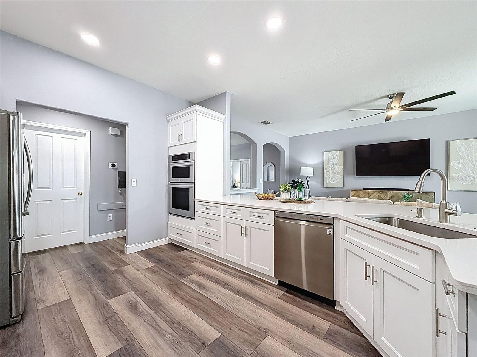 Kitchen Island, solid stone countertops, Stainless steel appliances throughout.