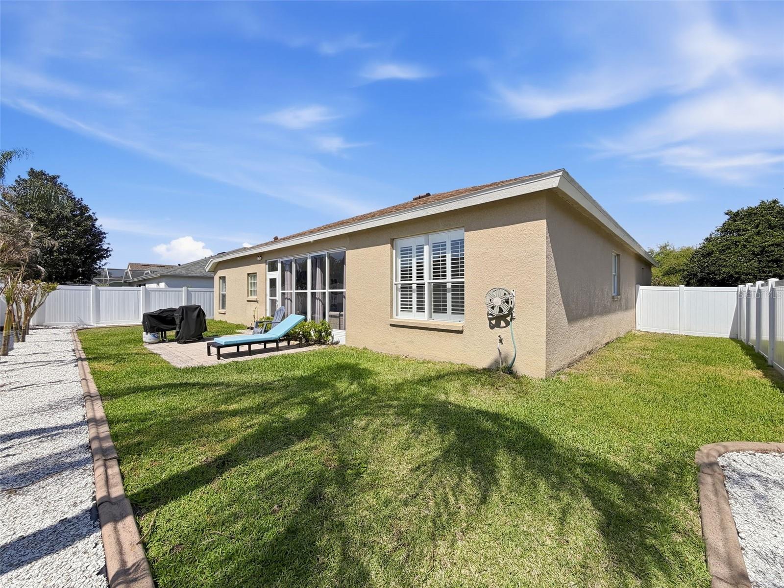 Large back yard, recently updated landscaping and new vinyl fencings surrounds.