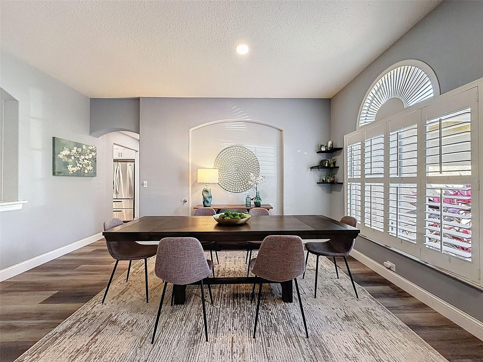 View of the dining room loking into the hallway to the kitchen.