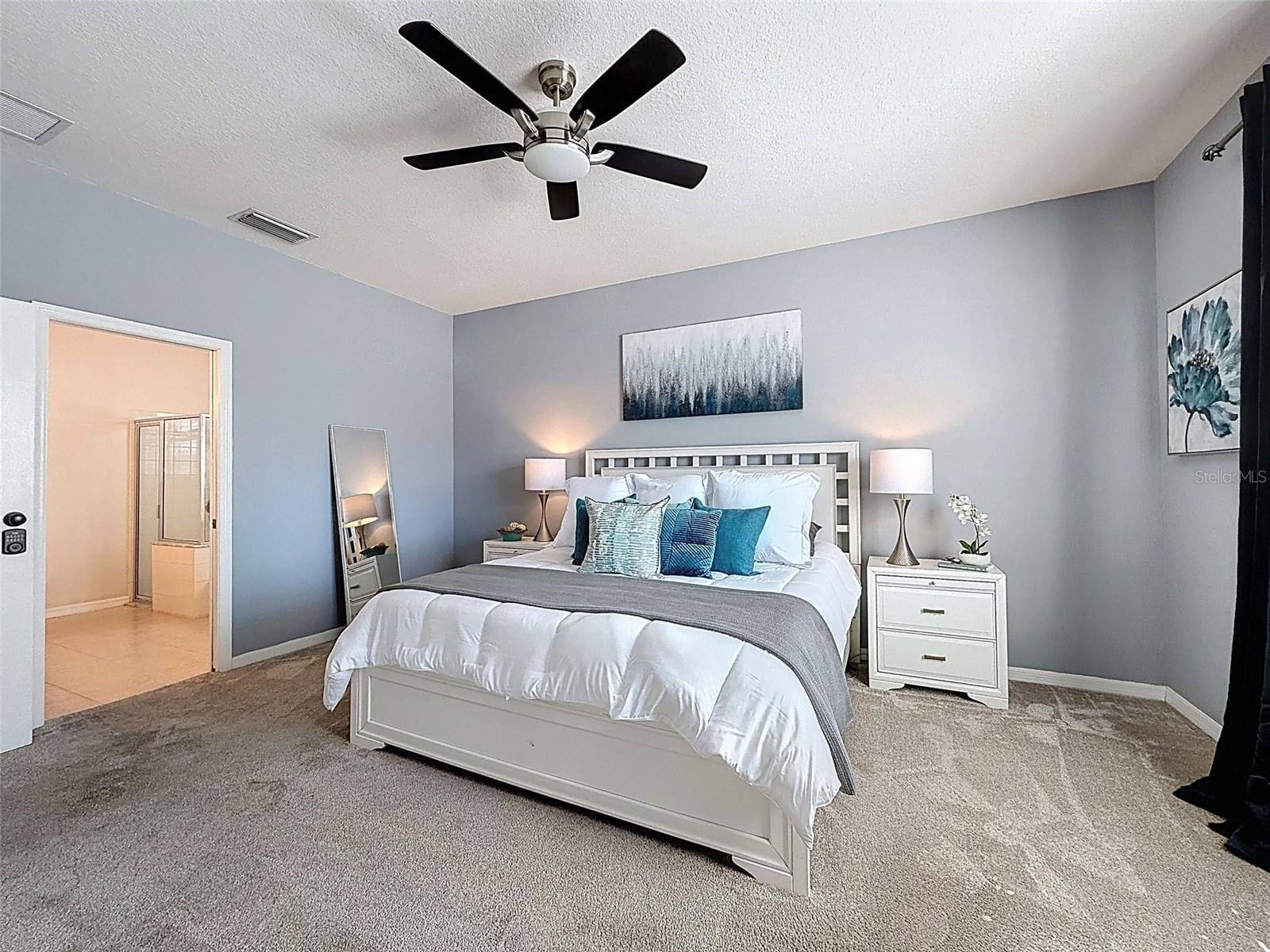 View of the master bedroom looking into the spacious master bathroom.