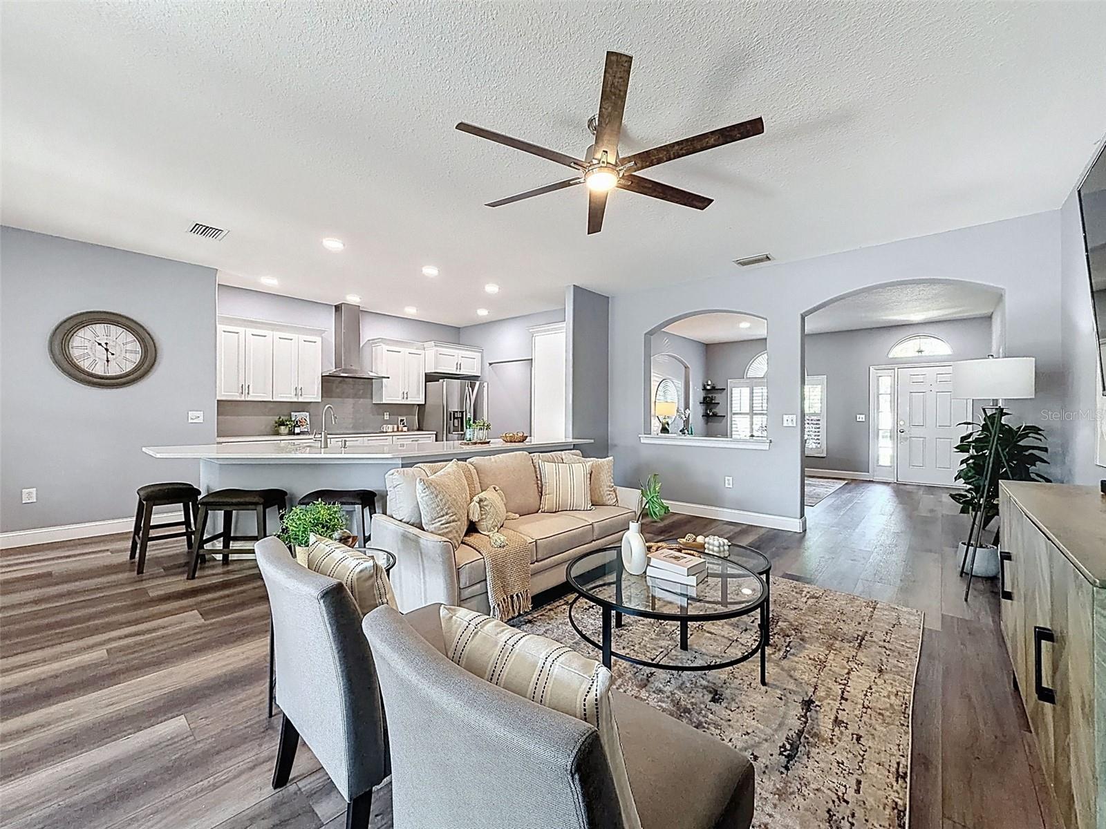 View of the great room facing the kitchen.  New fans in every room!