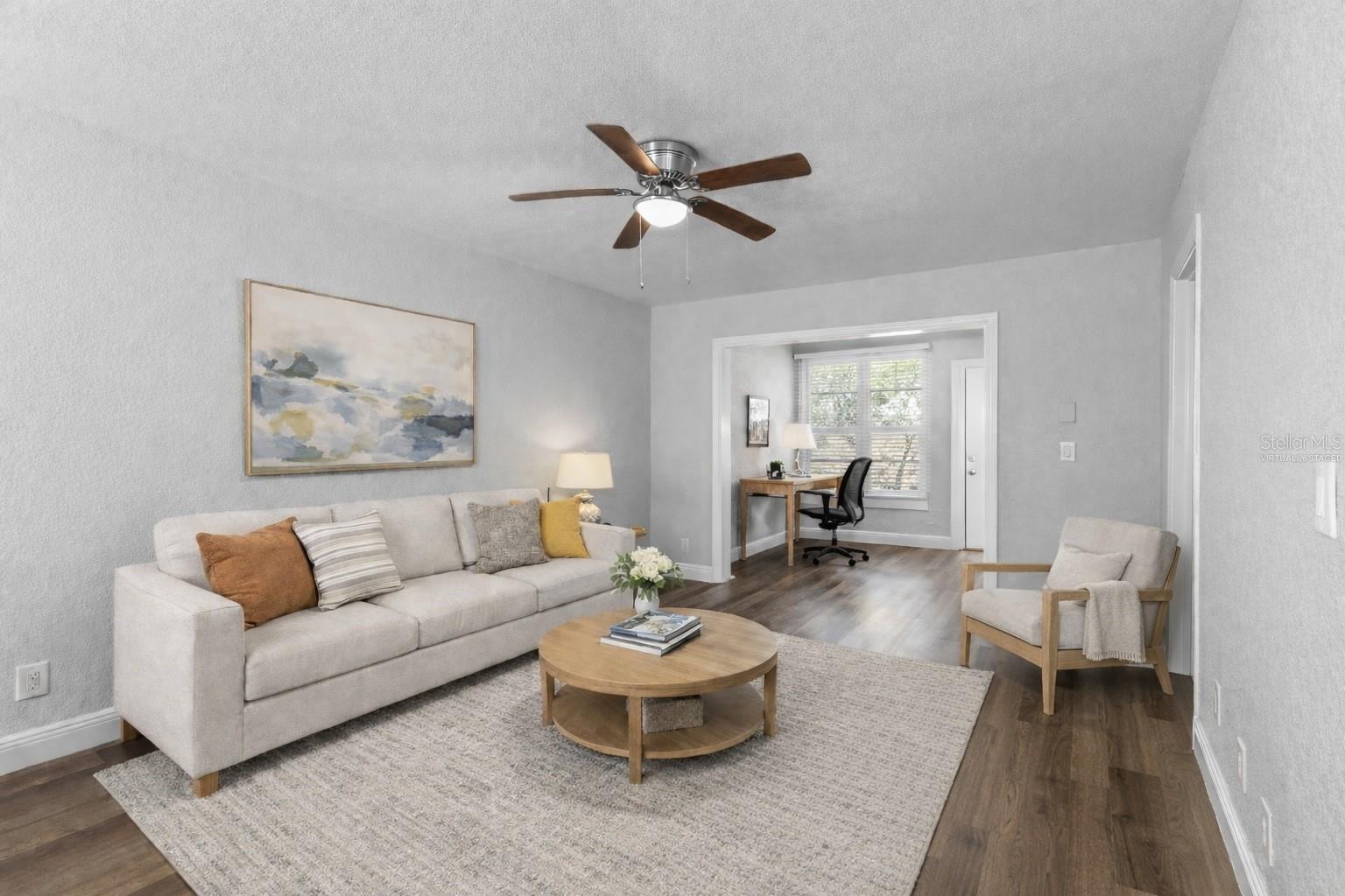 Living Room with bonus area in the back.  / Image is virtually staged.